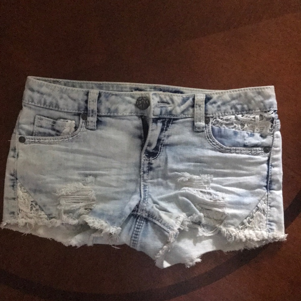Low rise light blue washed out ripped shorts